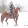 Amy riding Gypsy in the snow.